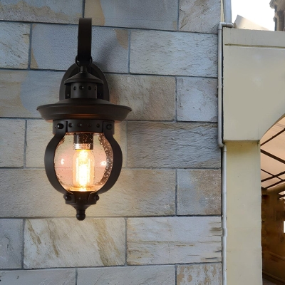 Elegant Matte Black Outdoor Wall Light with Seeded Glass Shade and Curved Arm, High-Quality Iron and Art Glass Lantern for Timeless Charm